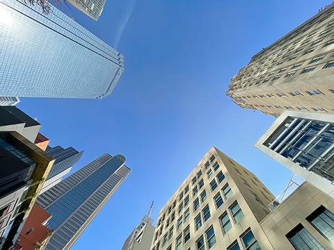 Lookup view skyscrapers and corporate office buildings under cle